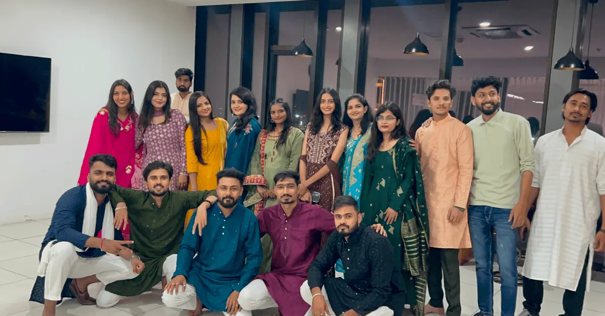 Employees in traditional outfits during Navratri celebration at Ignatiuz
